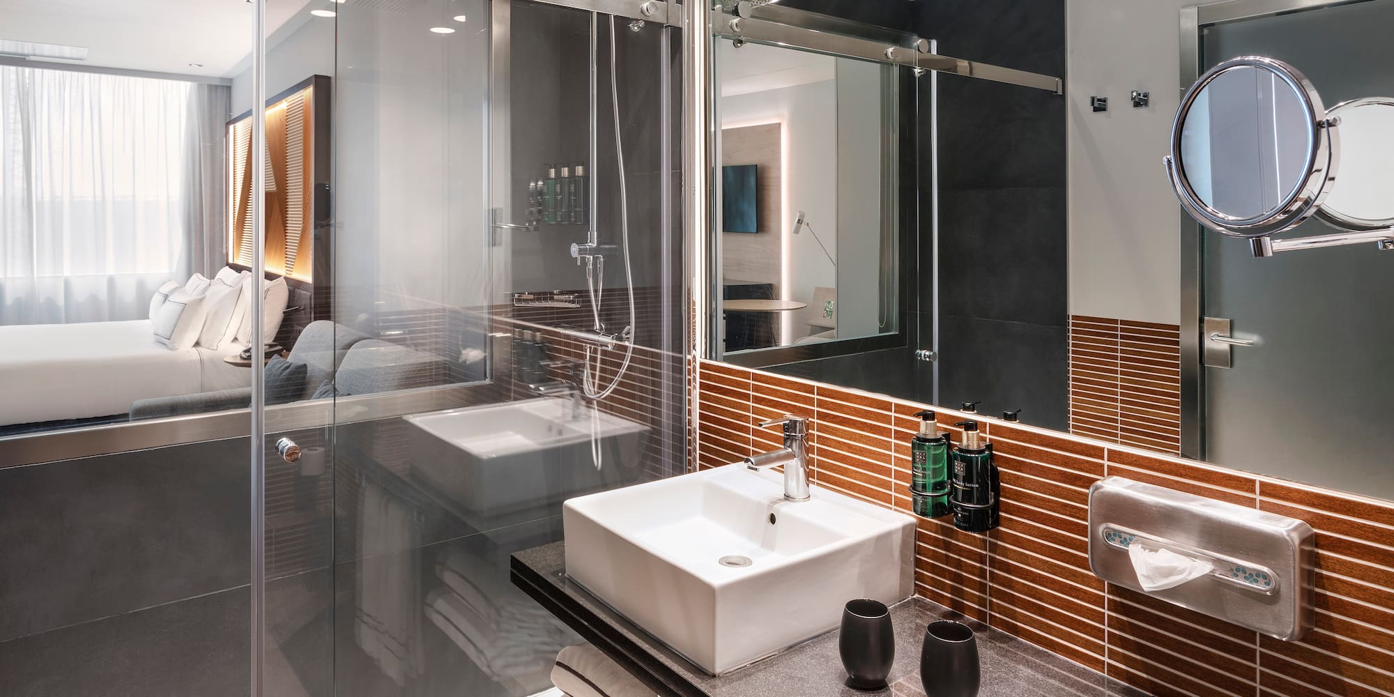 a bathroom with glass doors and sink