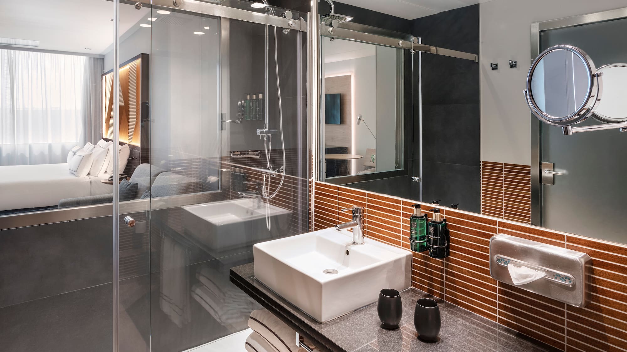 a bathroom with glass doors and sink