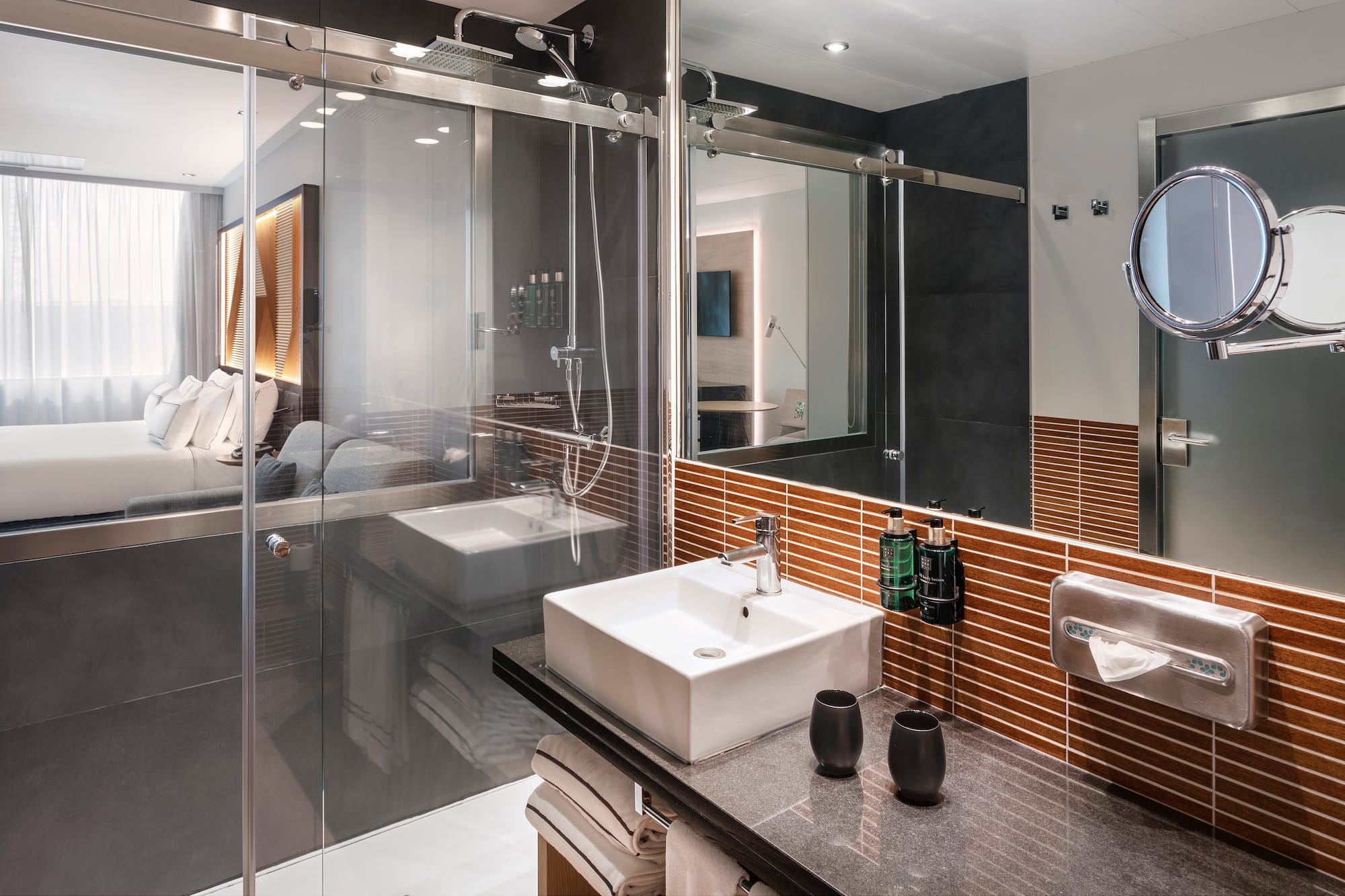 a bathroom with glass doors and sink