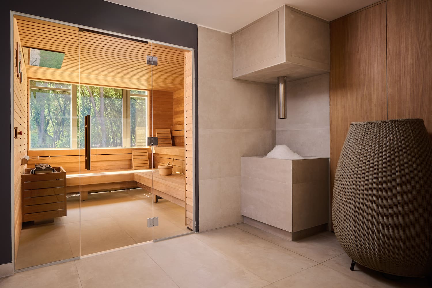 a room with a glass door and a sauna