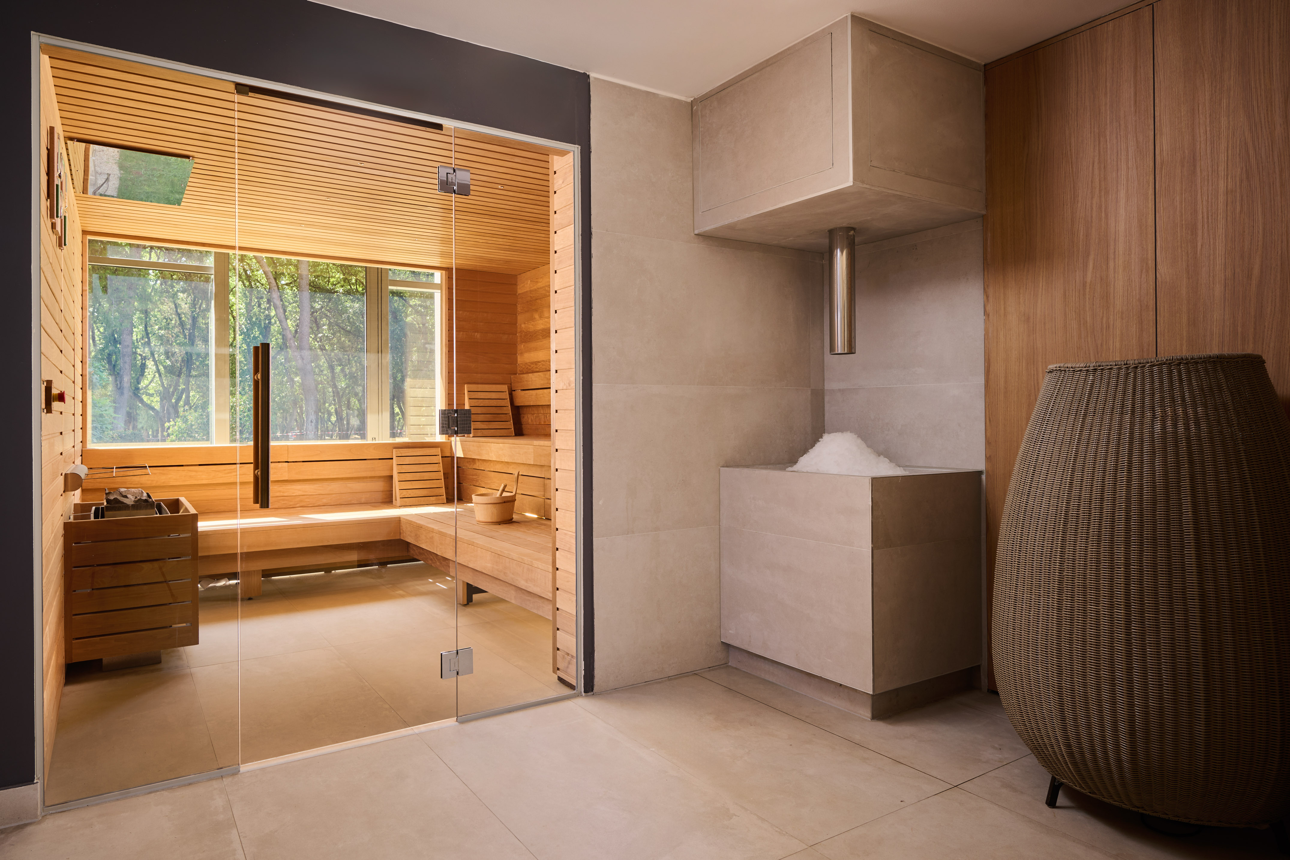 a room with a glass door and a sauna