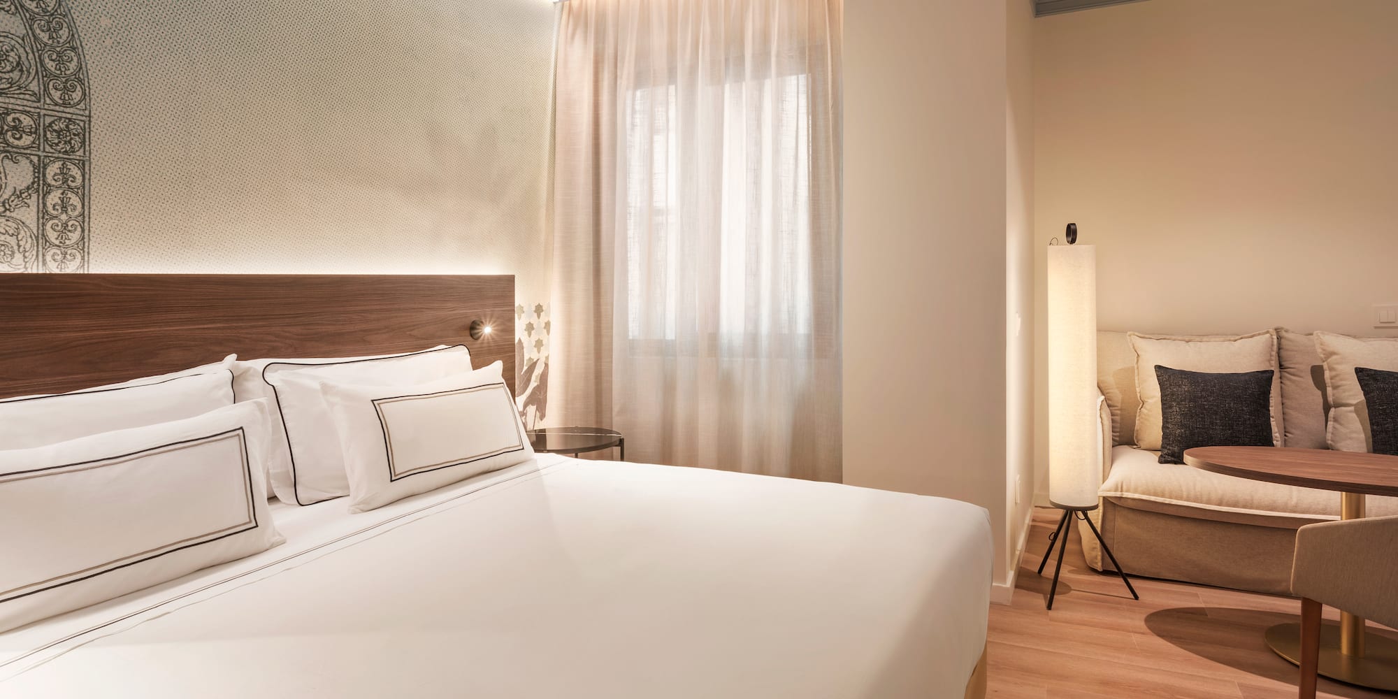 a bedroom with a bed and a chair