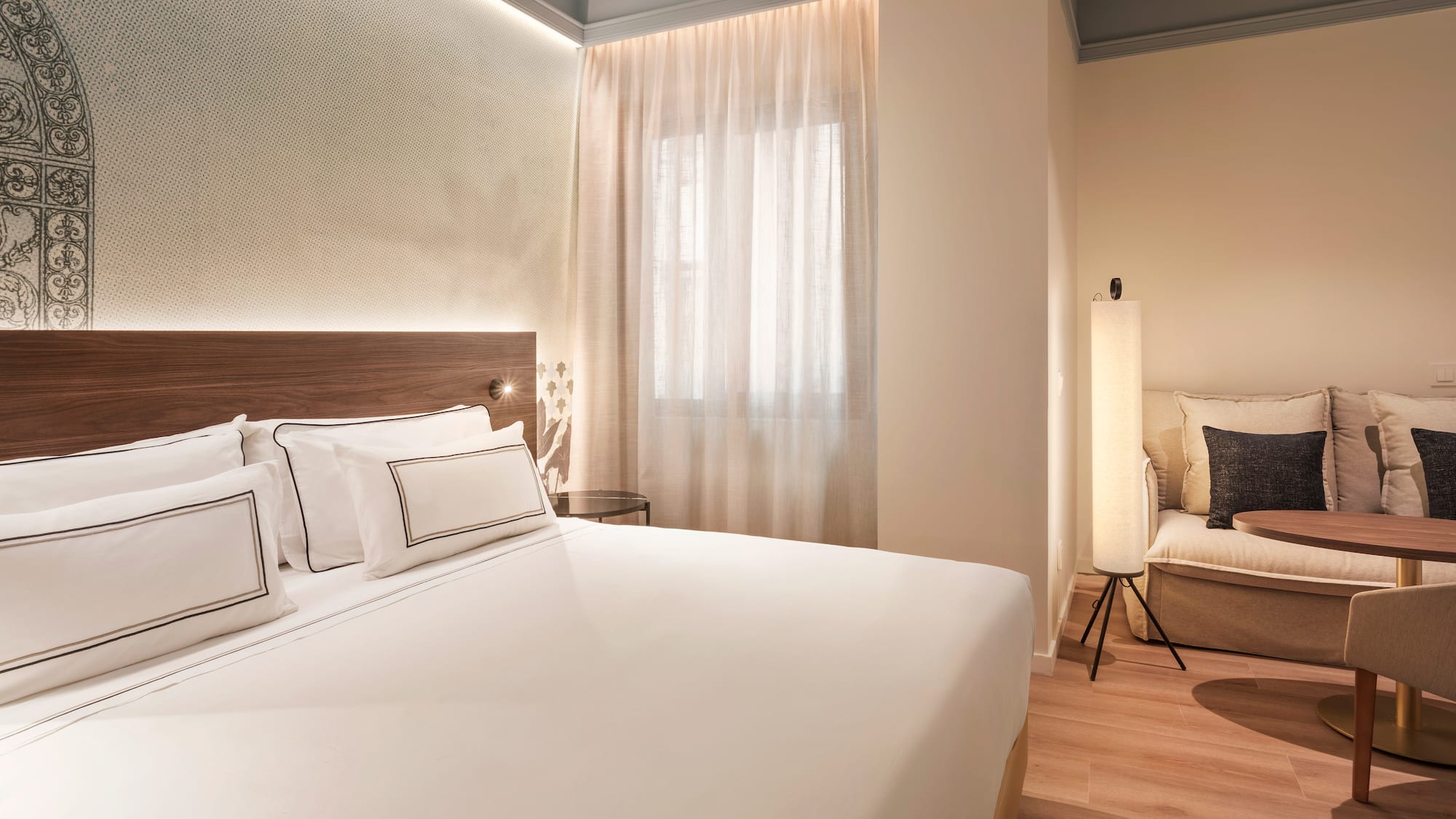 a bedroom with a bed and a chair