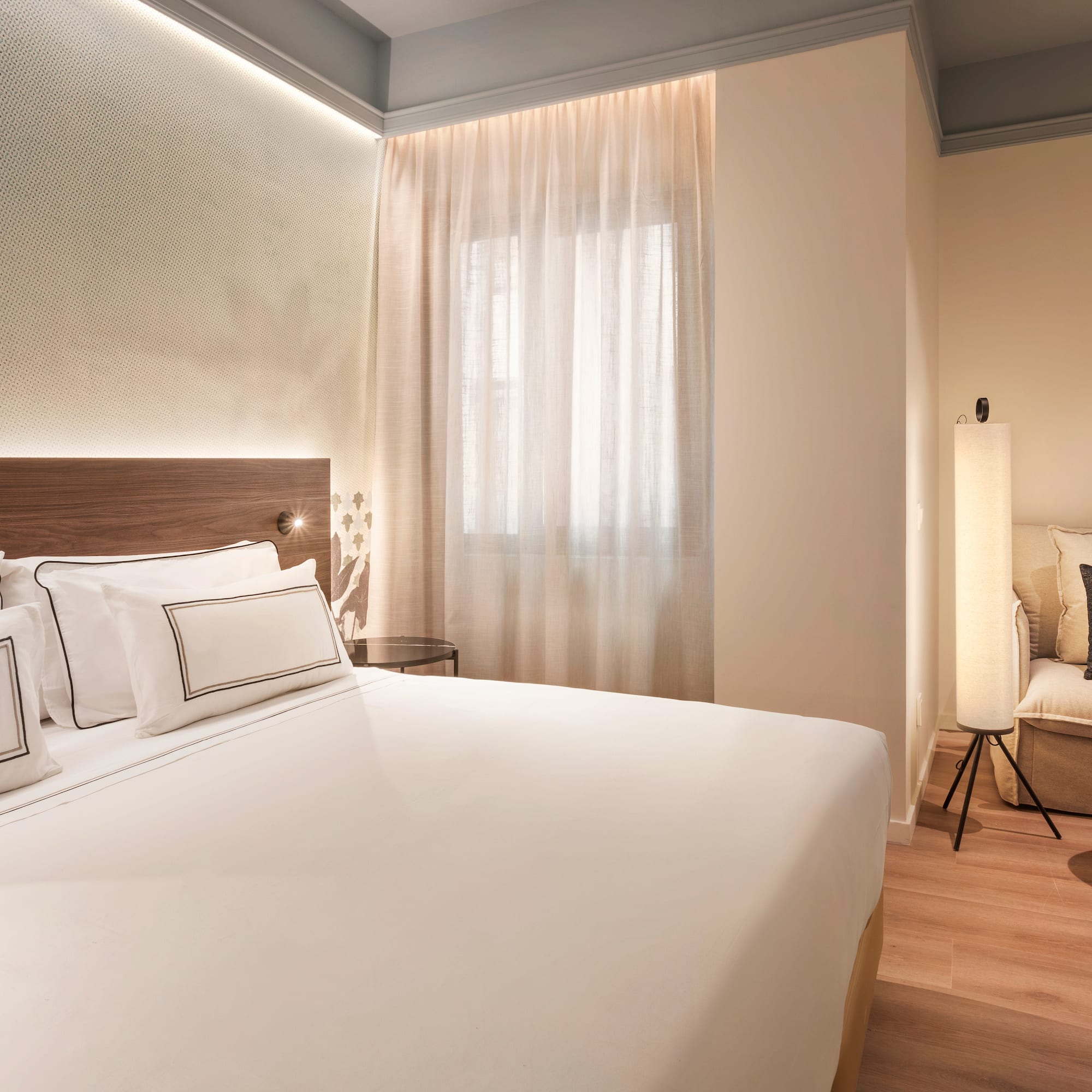 a bedroom with a bed and a chair