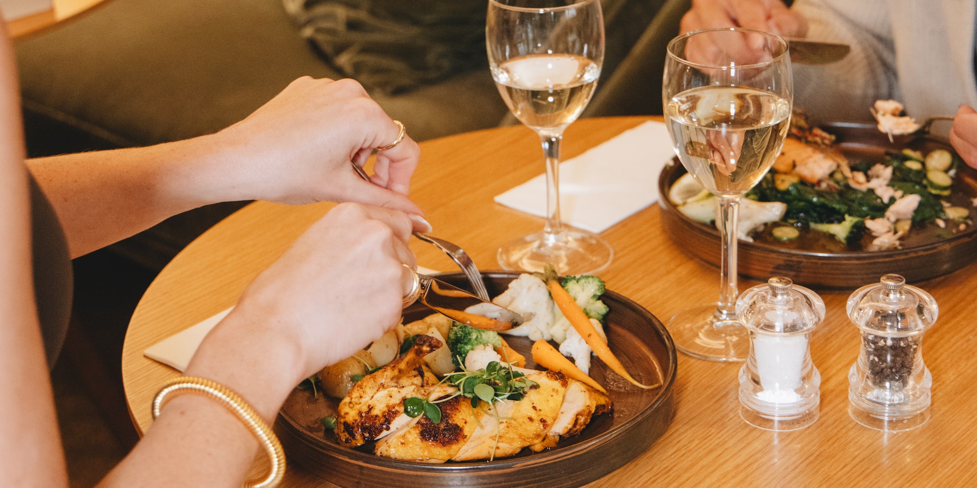 a person eating food at a table