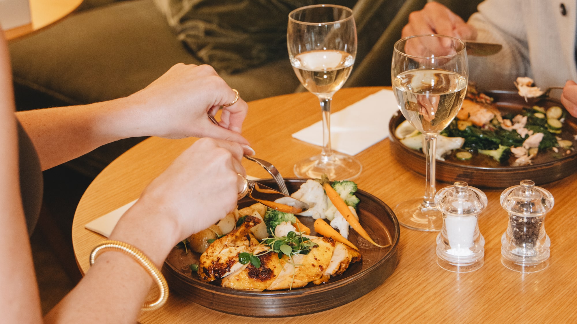 a person eating food at a table
