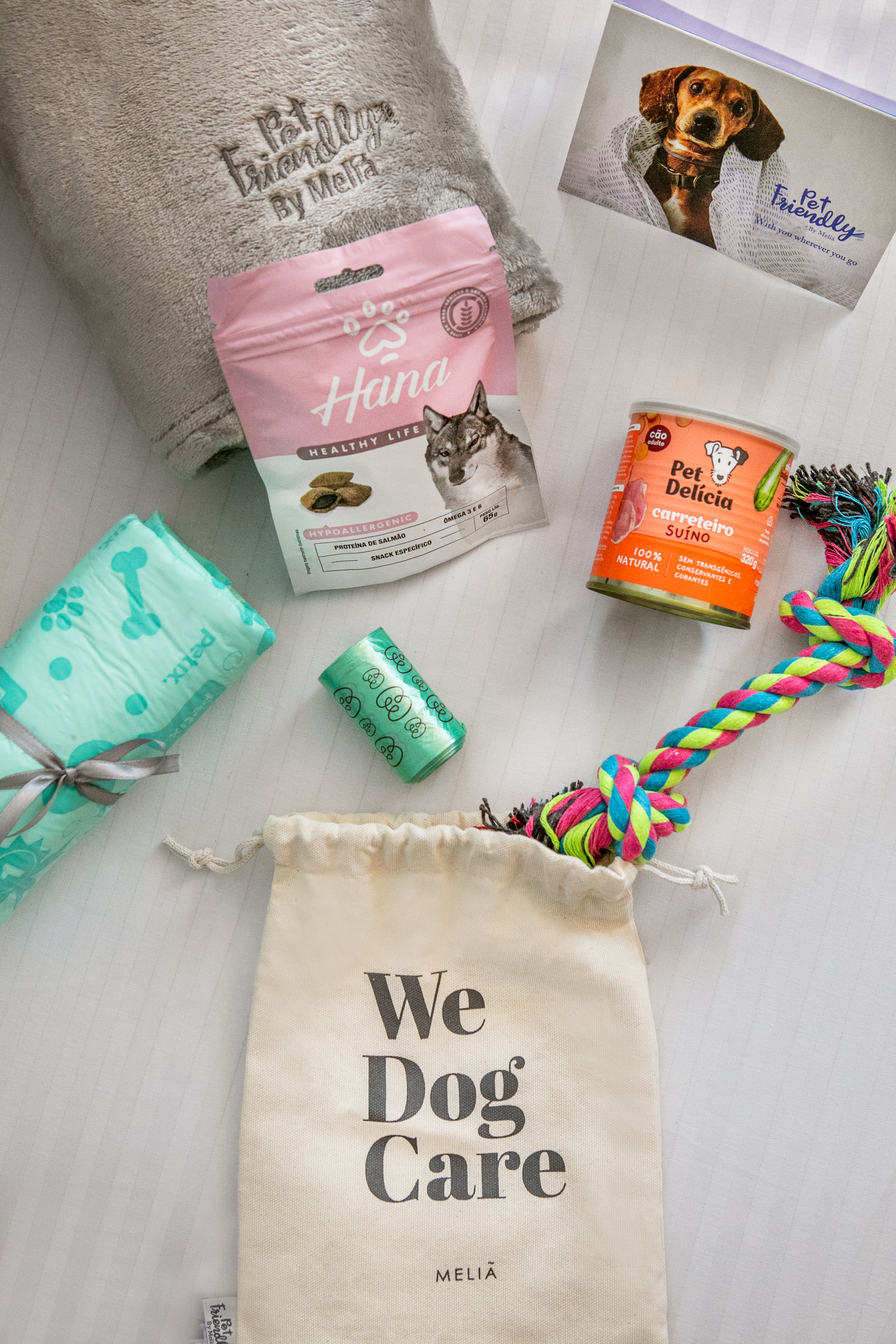 a group of dog food and toys