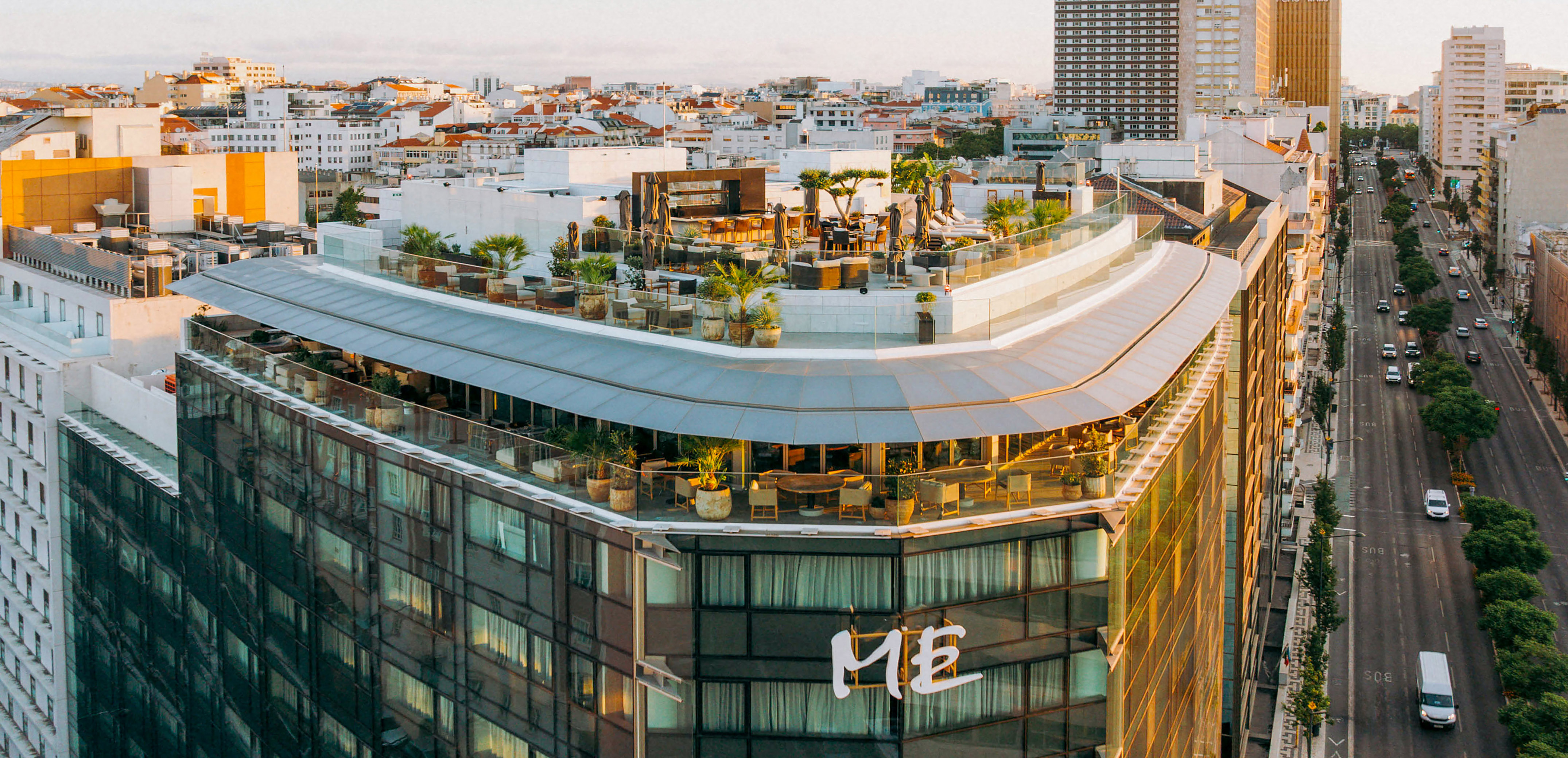 a rooftop of a building with a rooftop bar and a city