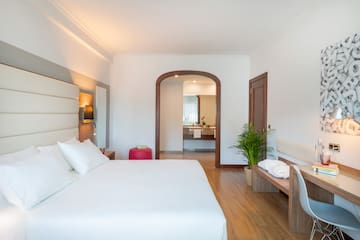 a bedroom with a bed and a bench