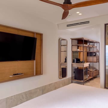 a room with a television and a tv on the wall