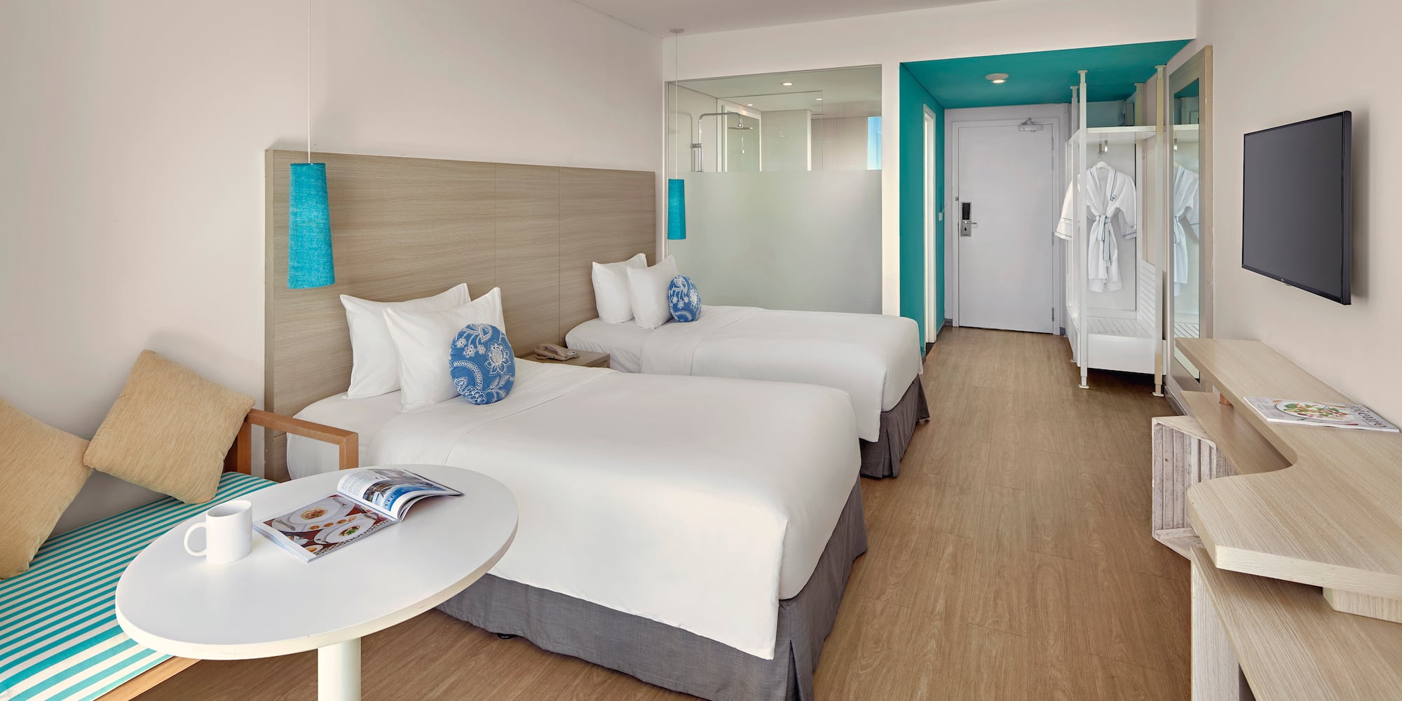 a room with two beds and a table