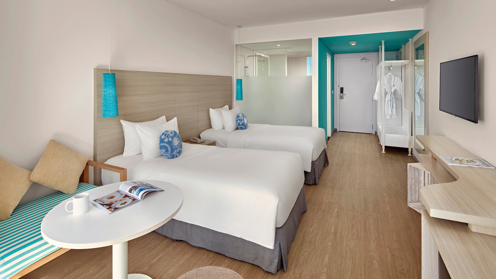 a room with two beds and a table