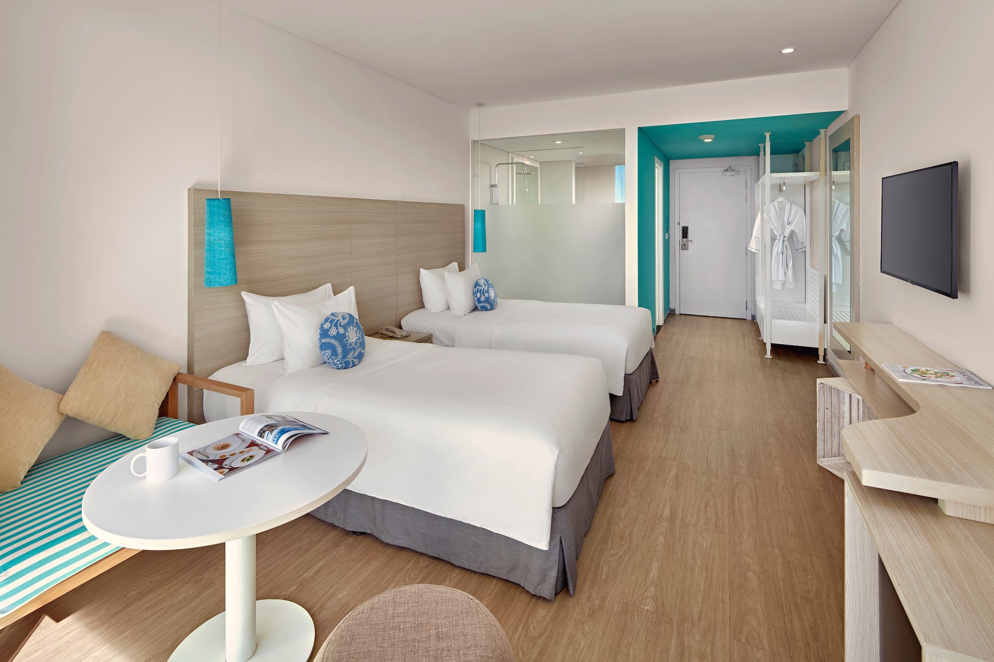 a room with two beds and a table