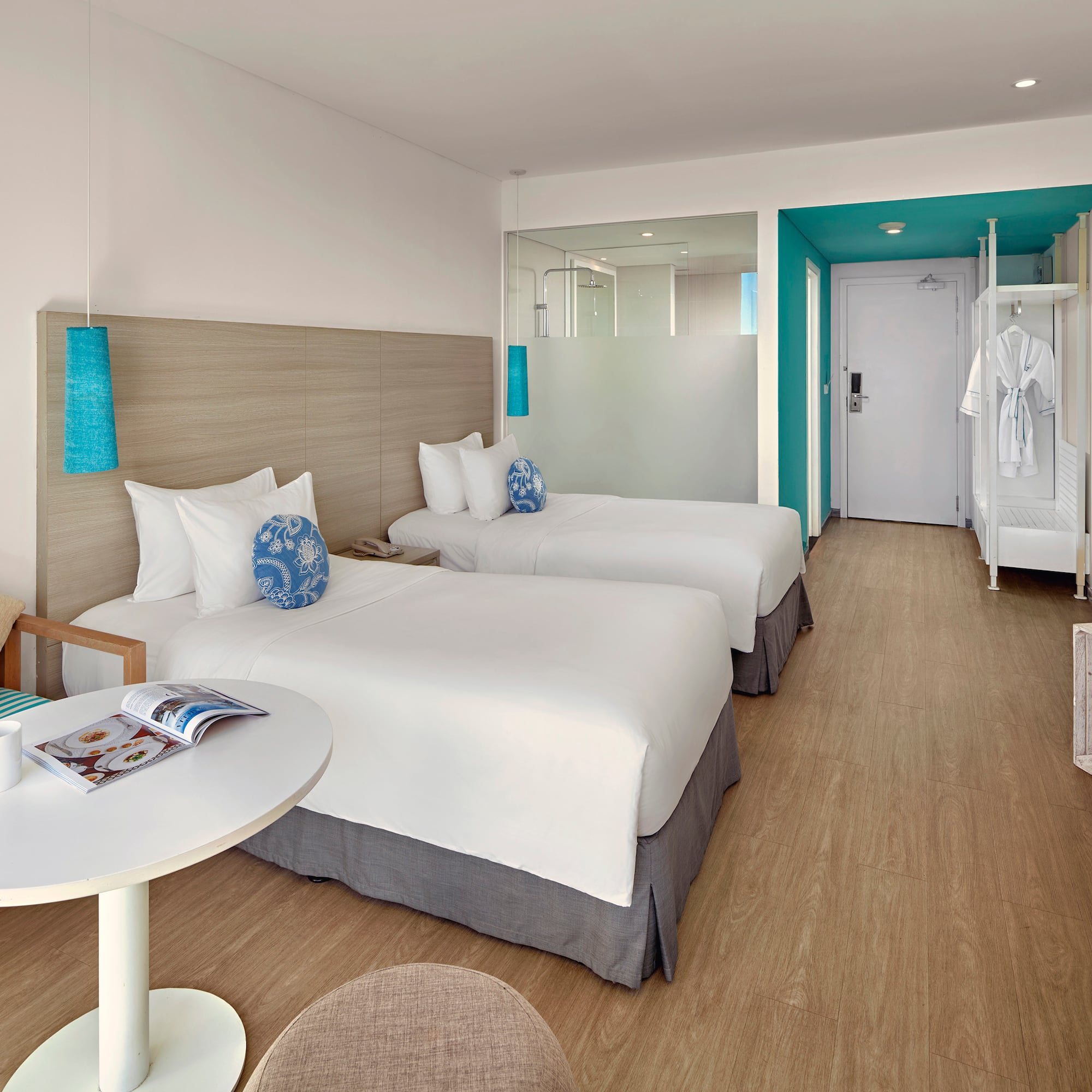 a room with two beds and a table