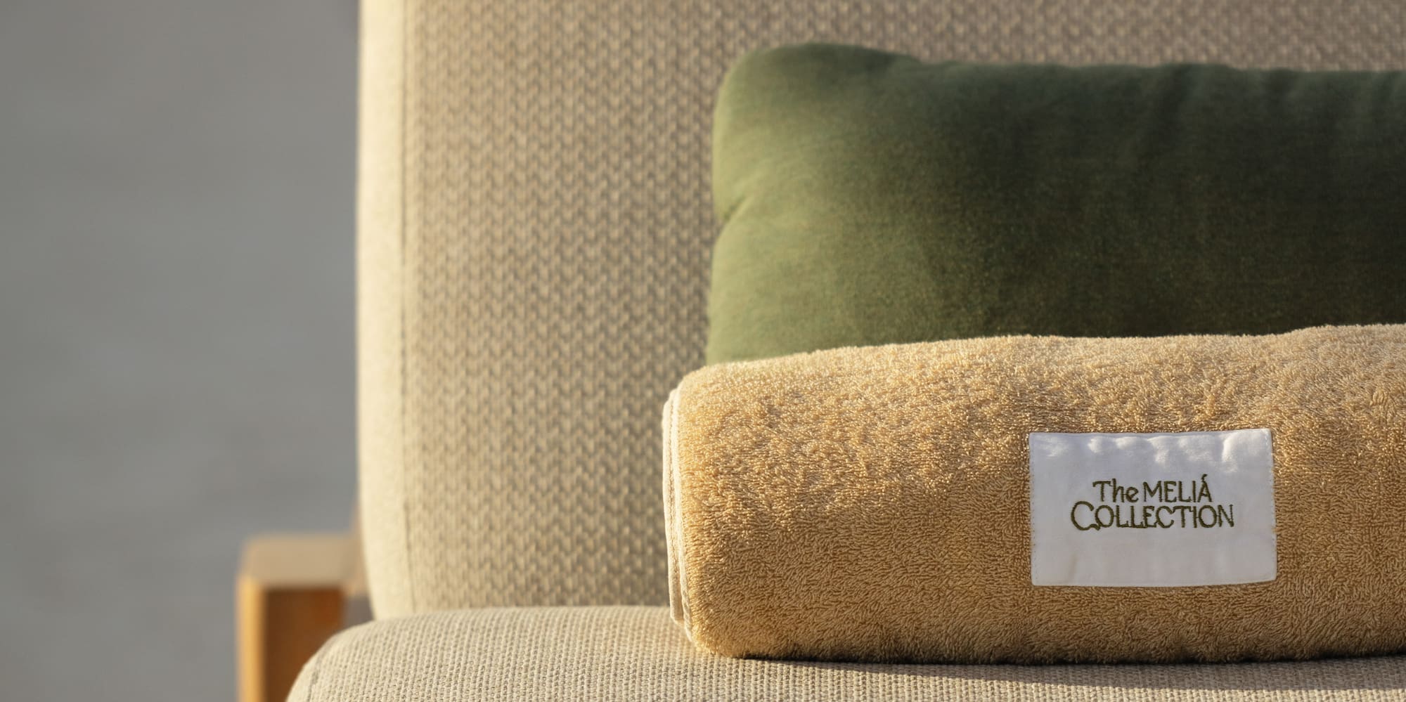 a rolled up pillow on a couch
