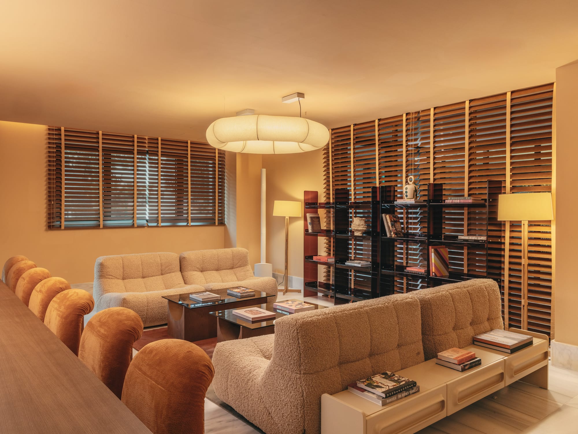 a room with couches and a bookcase