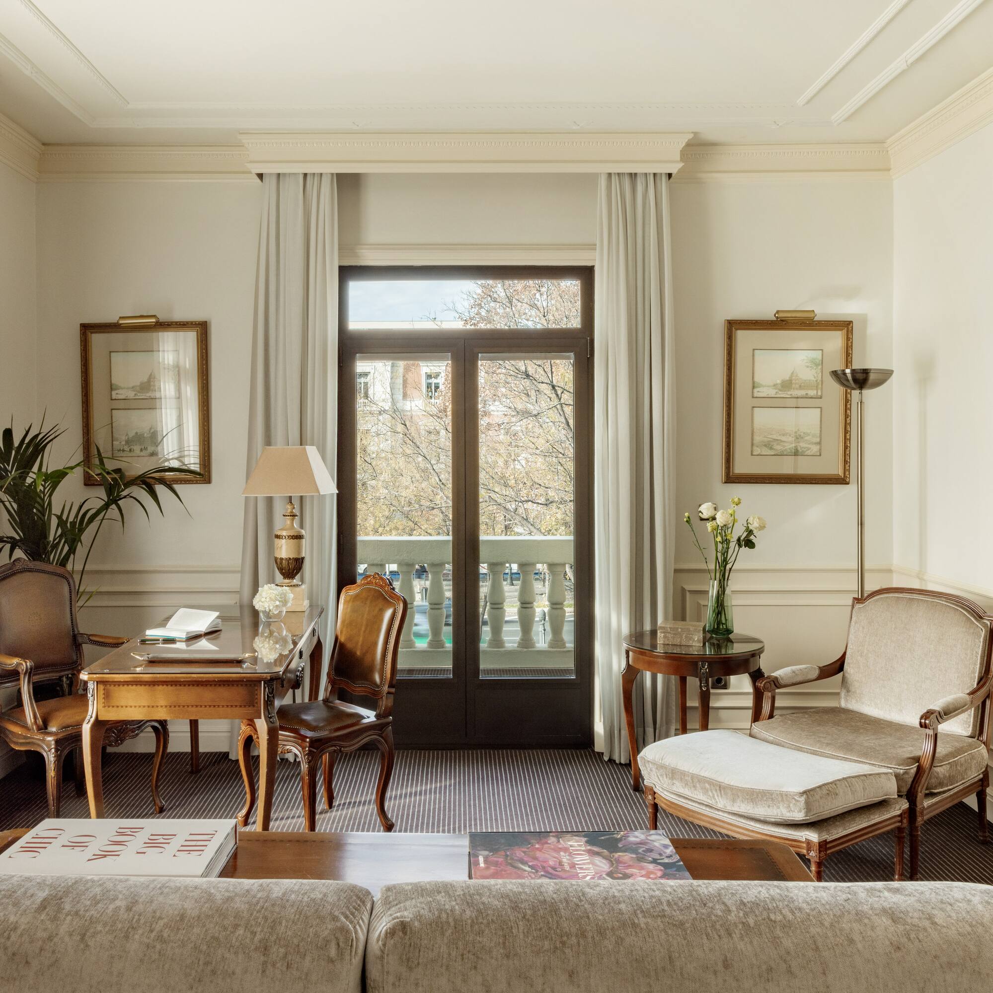 a living room with a couch and chairs