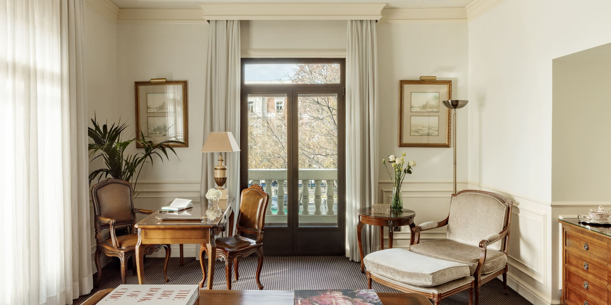 a living room with a couch and chairs