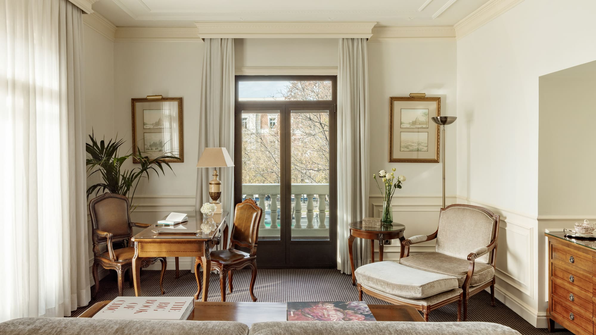 a living room with a couch and chairs