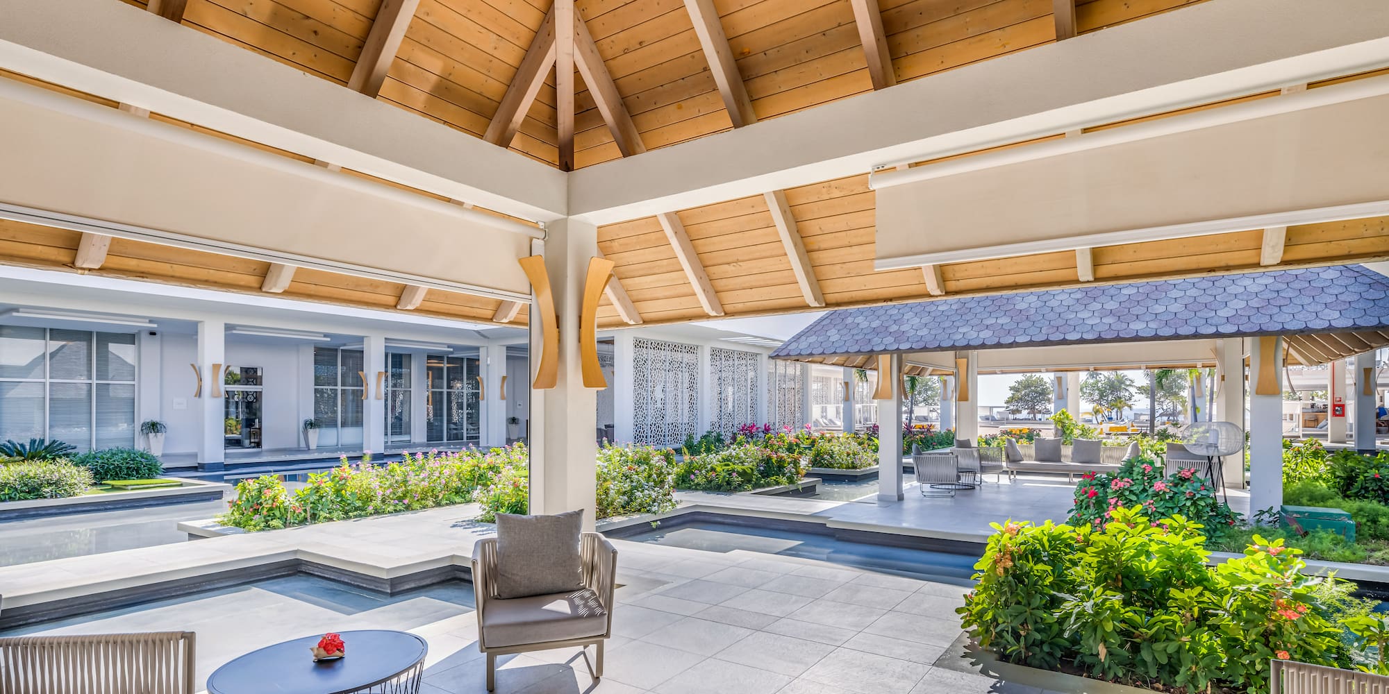 a patio with a chair and a table