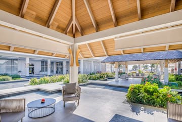 a patio with a chair and a table