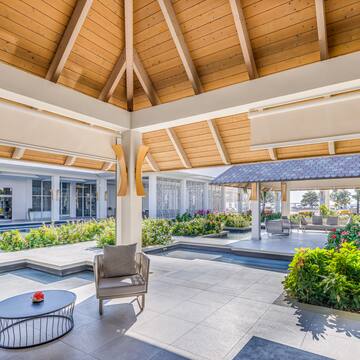 a patio with a chair and a table