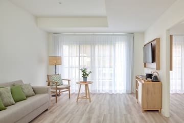 a living room with a tv and a couch