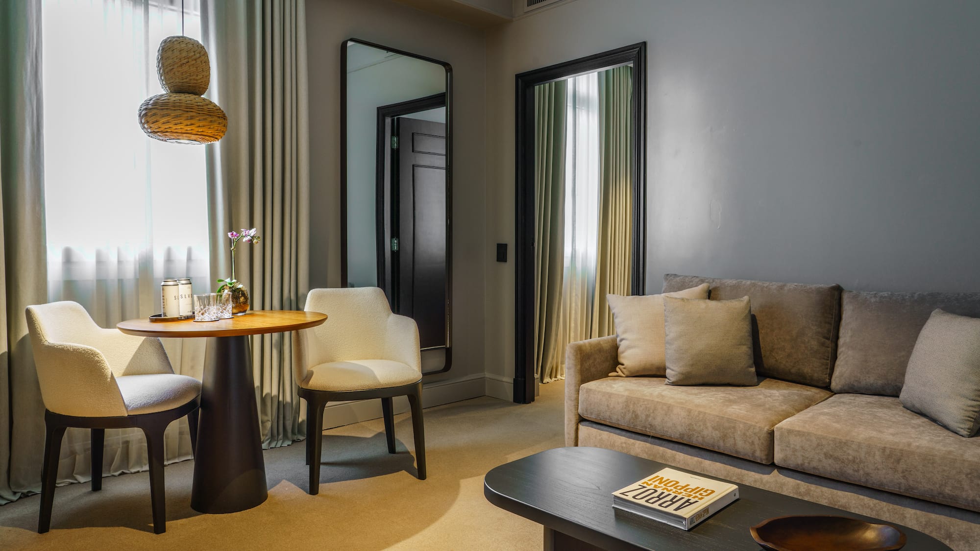 a living room with a table and chairs