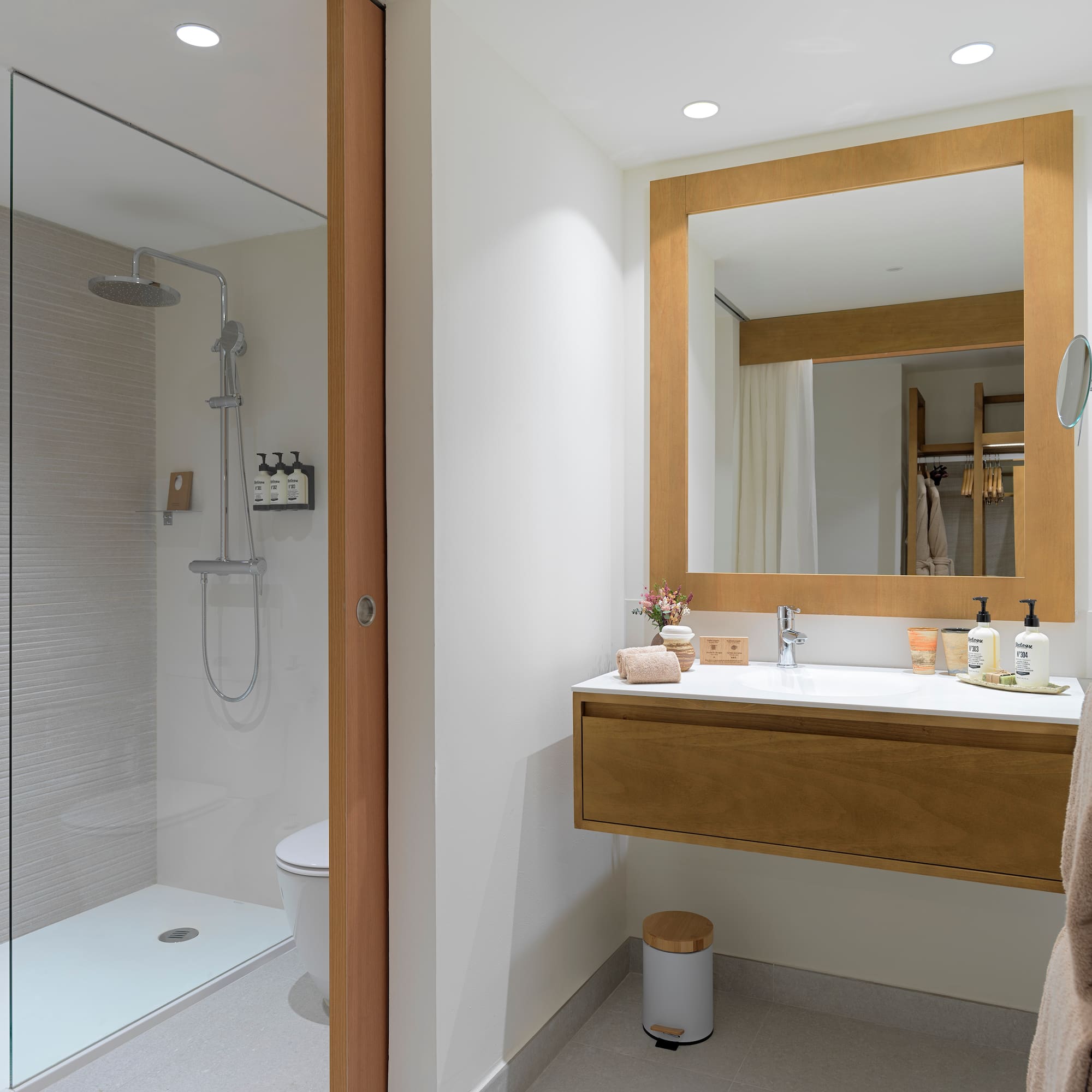 a bathroom with a shower and a sink