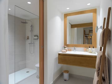 a bathroom with a shower and a sink