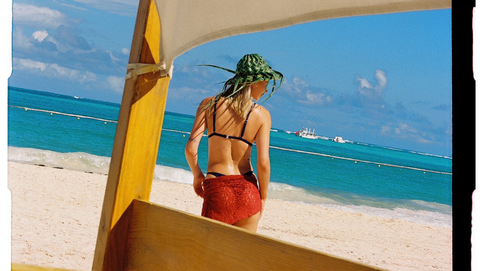 a woman in a garment on a beach