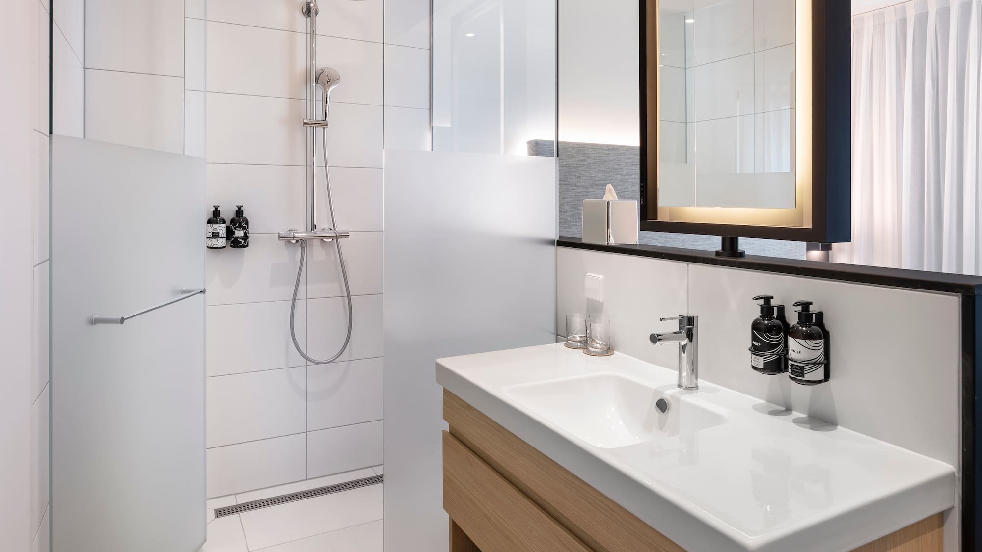 a bathroom with a shower and sink