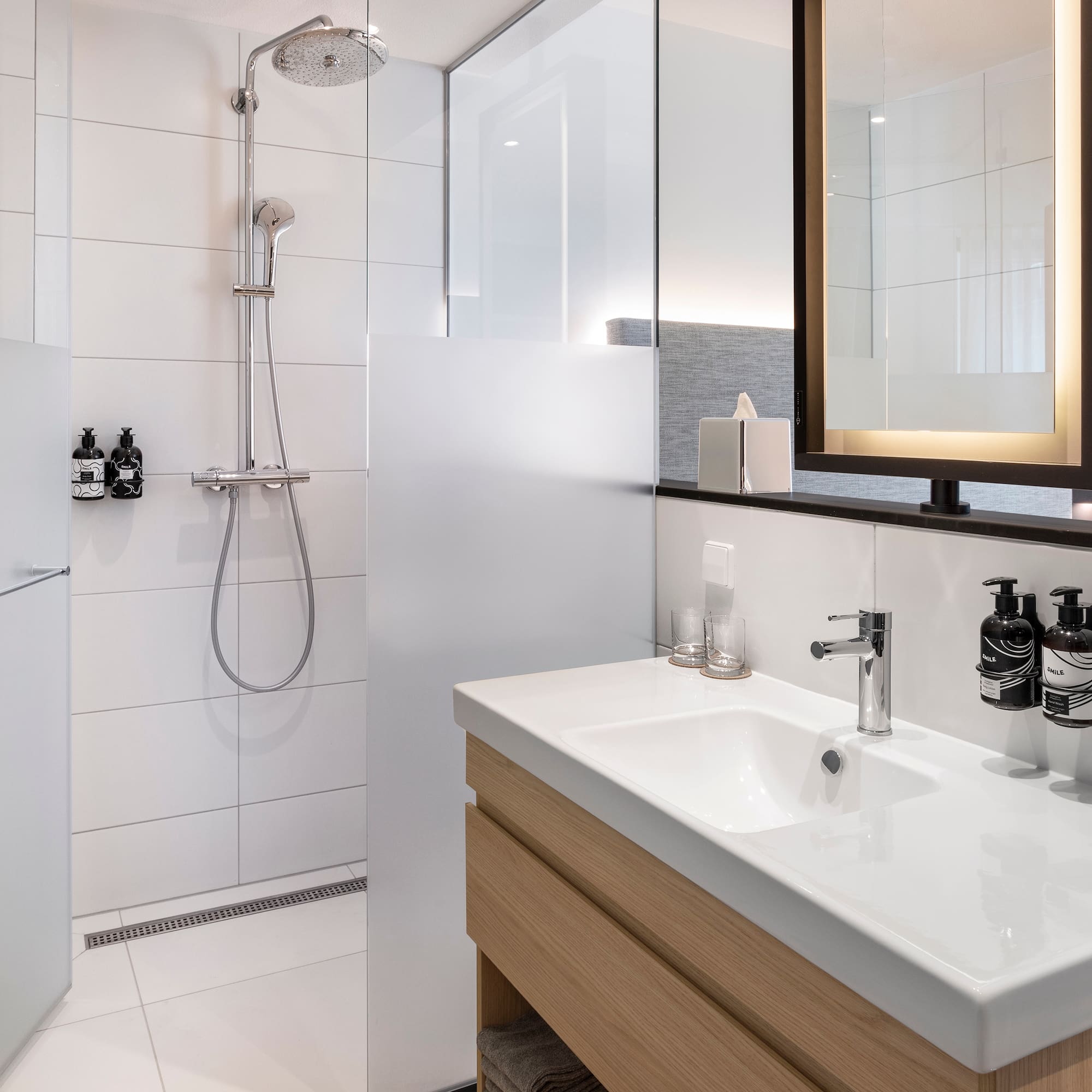 a bathroom with a shower and sink