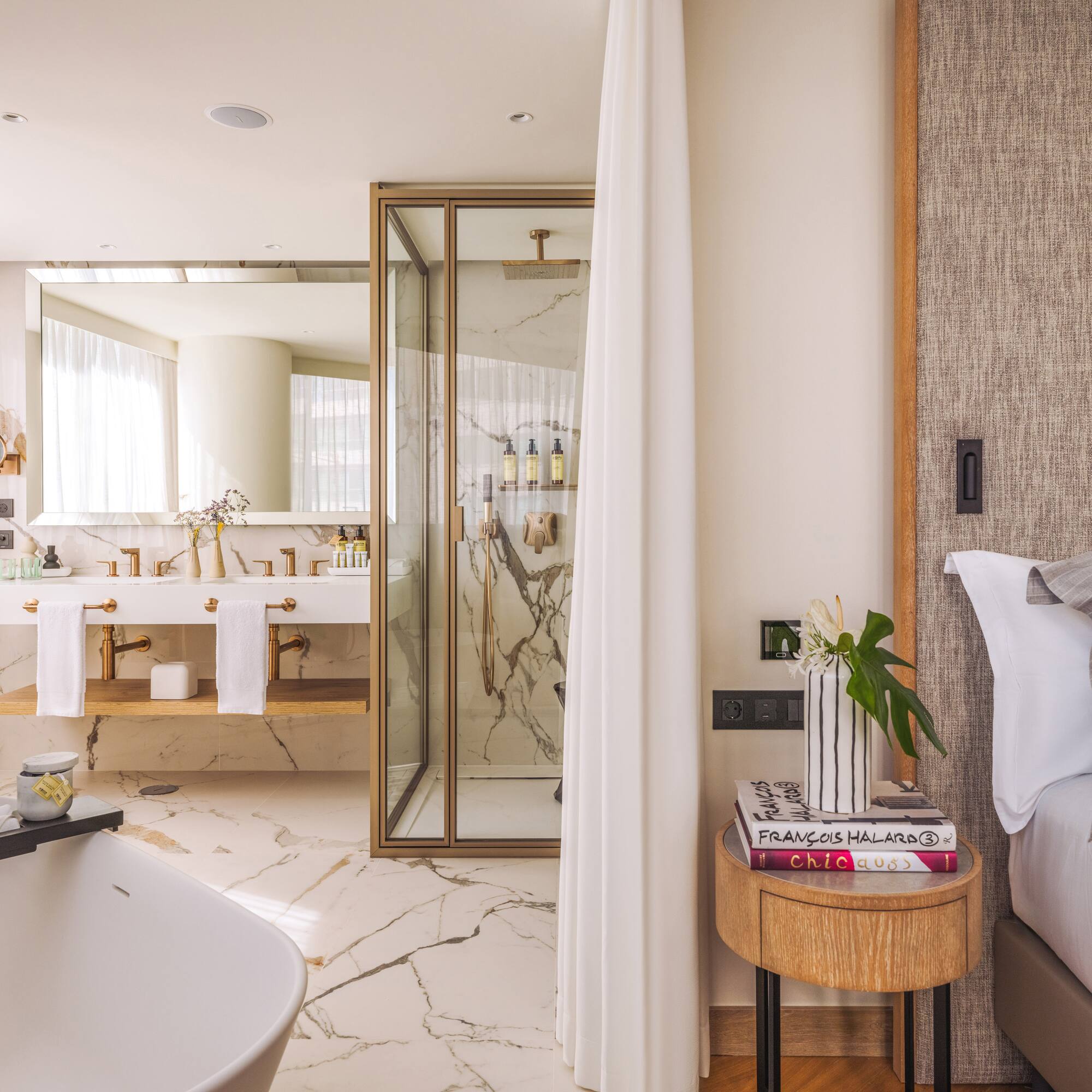 a bathroom with a bathtub and a shower