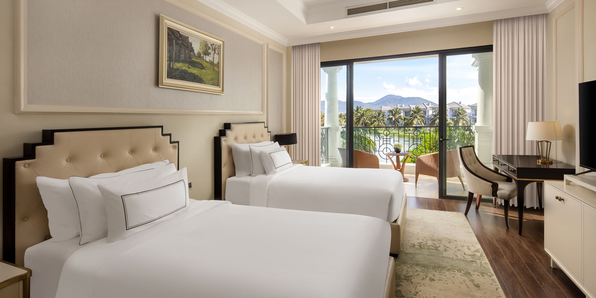 a room with two beds and a balcony