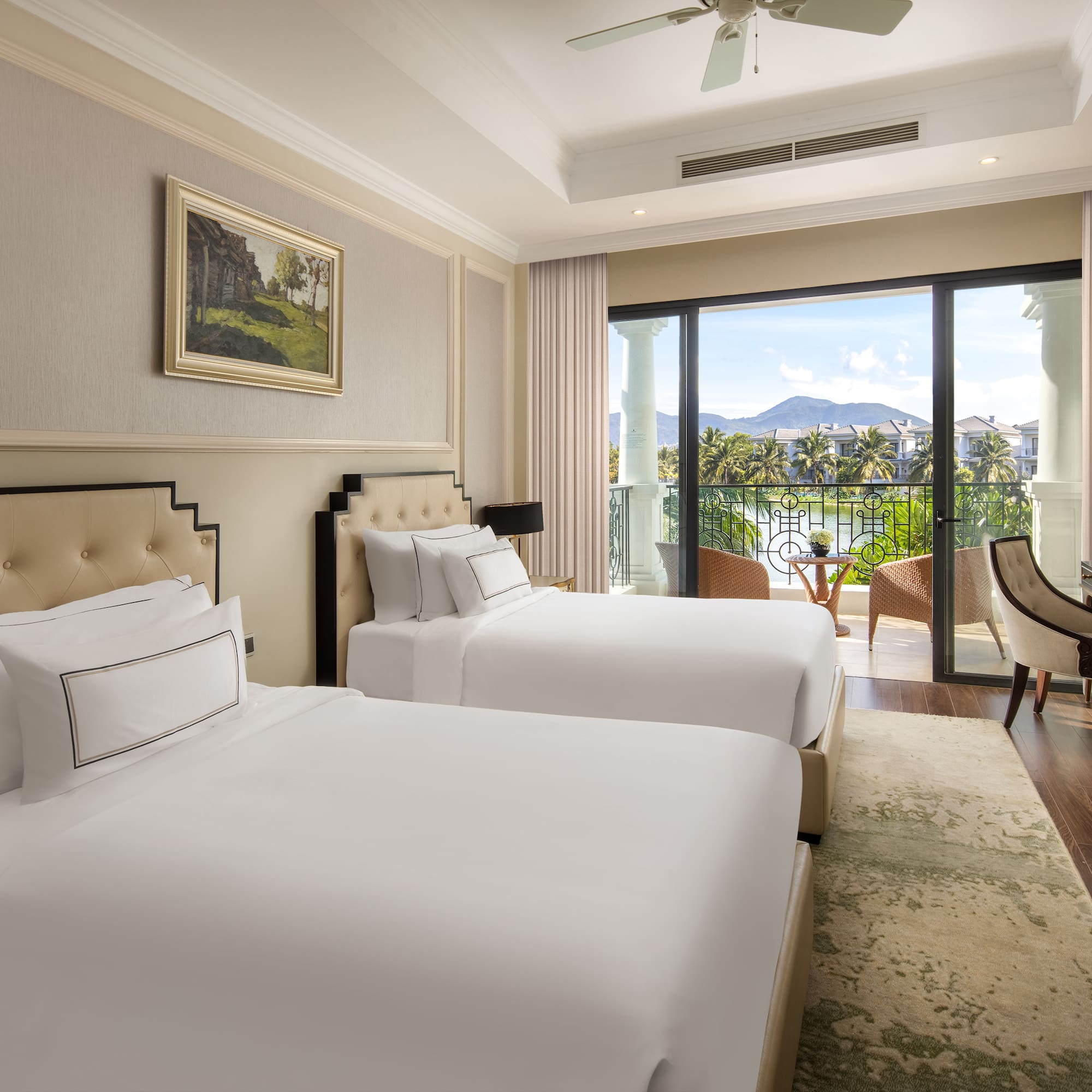 a room with two beds and a balcony