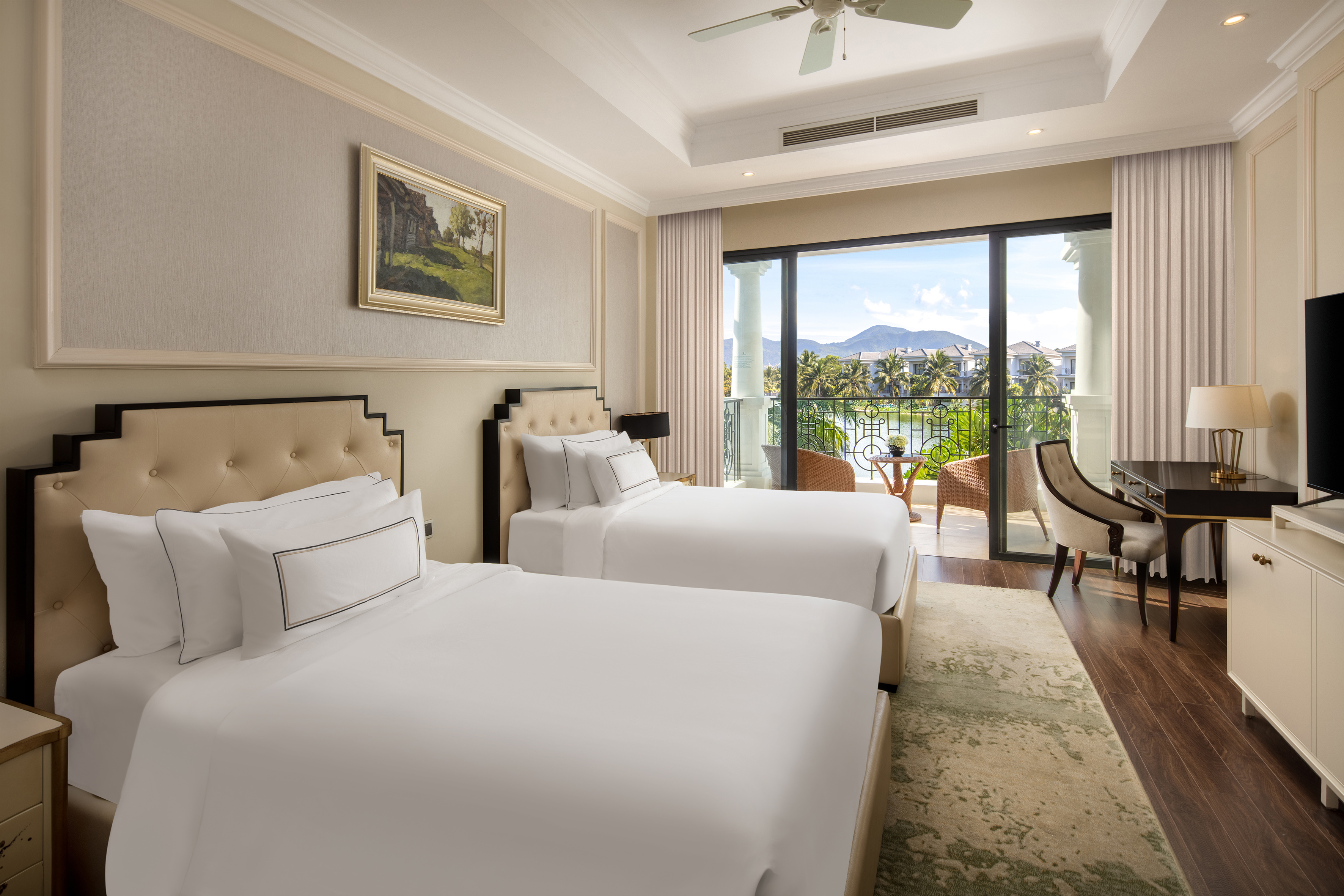 a room with two beds and a balcony