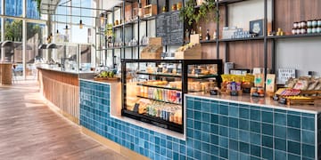a counter with drinks and beverages on it