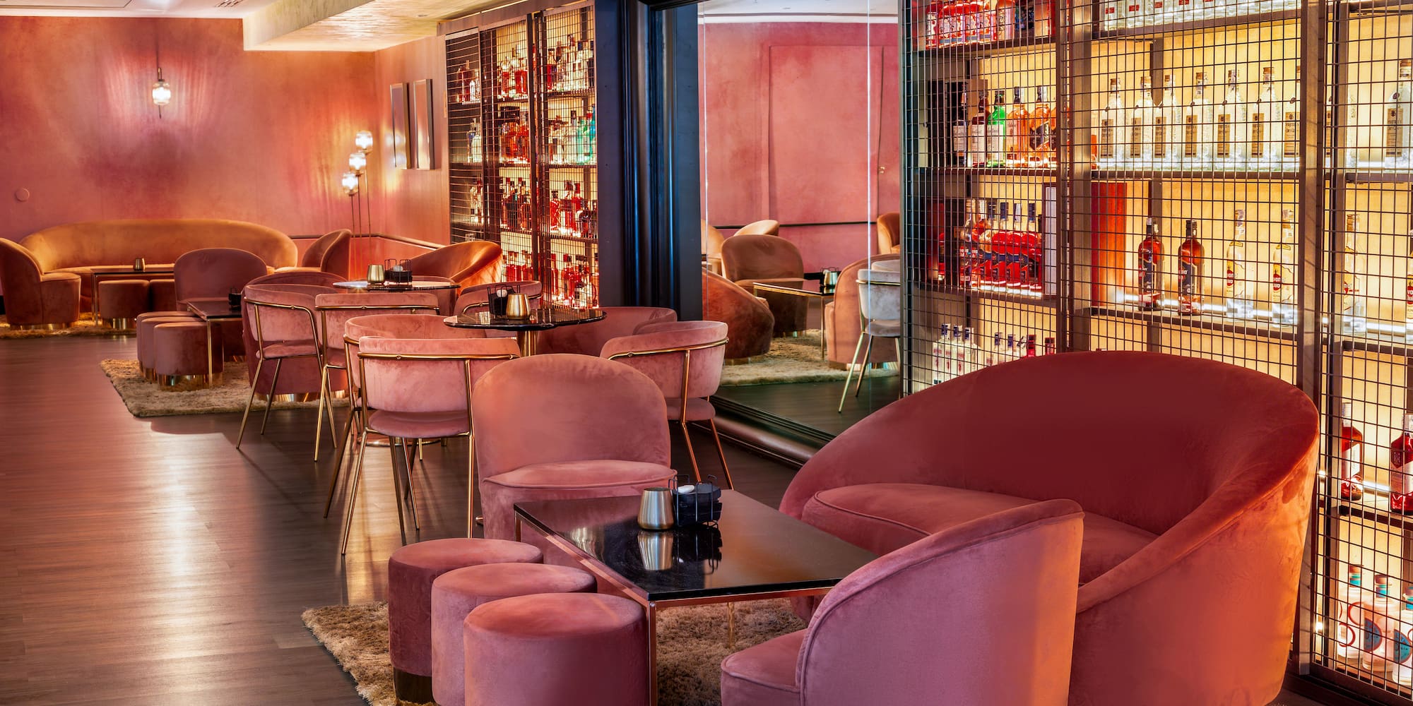 a room with pink chairs and tables