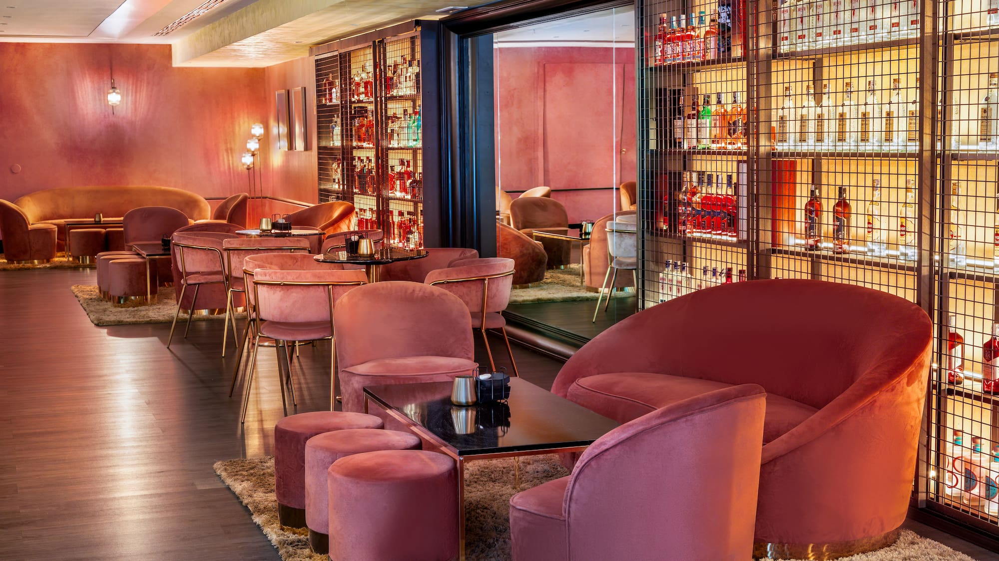 a room with pink chairs and tables