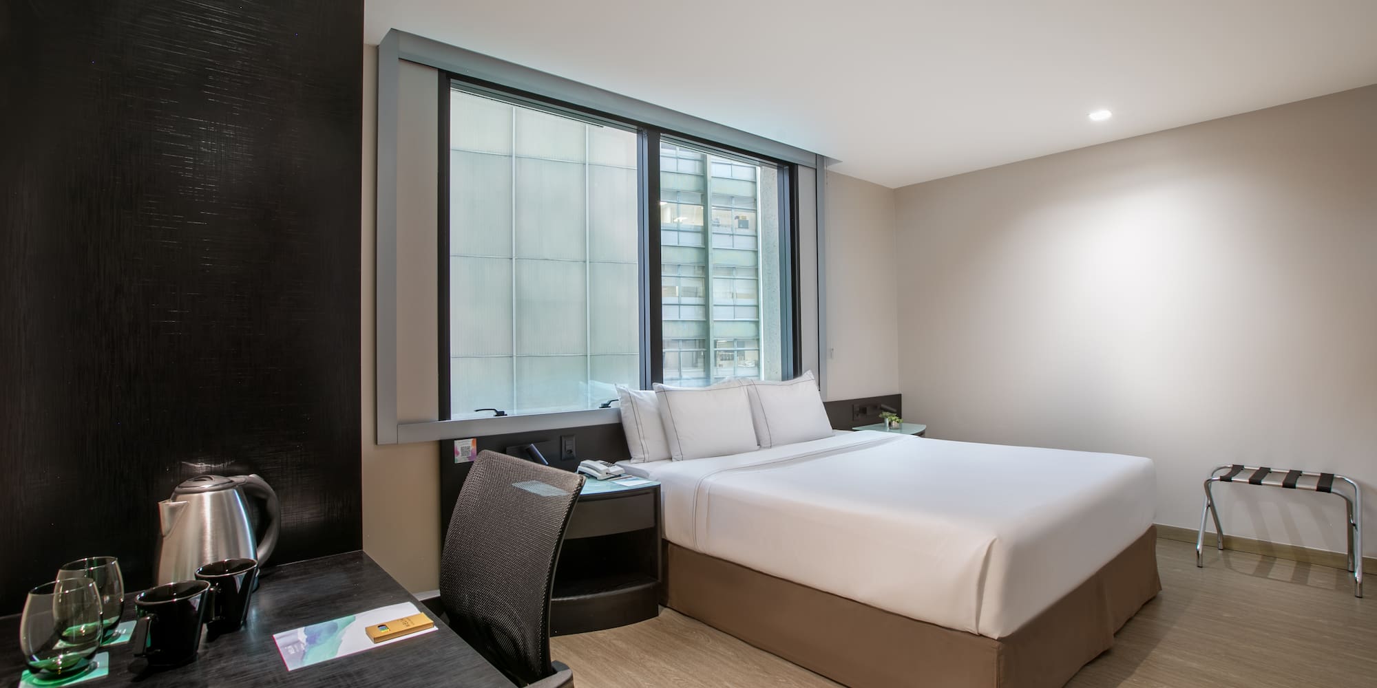 a room with a bed and a desk