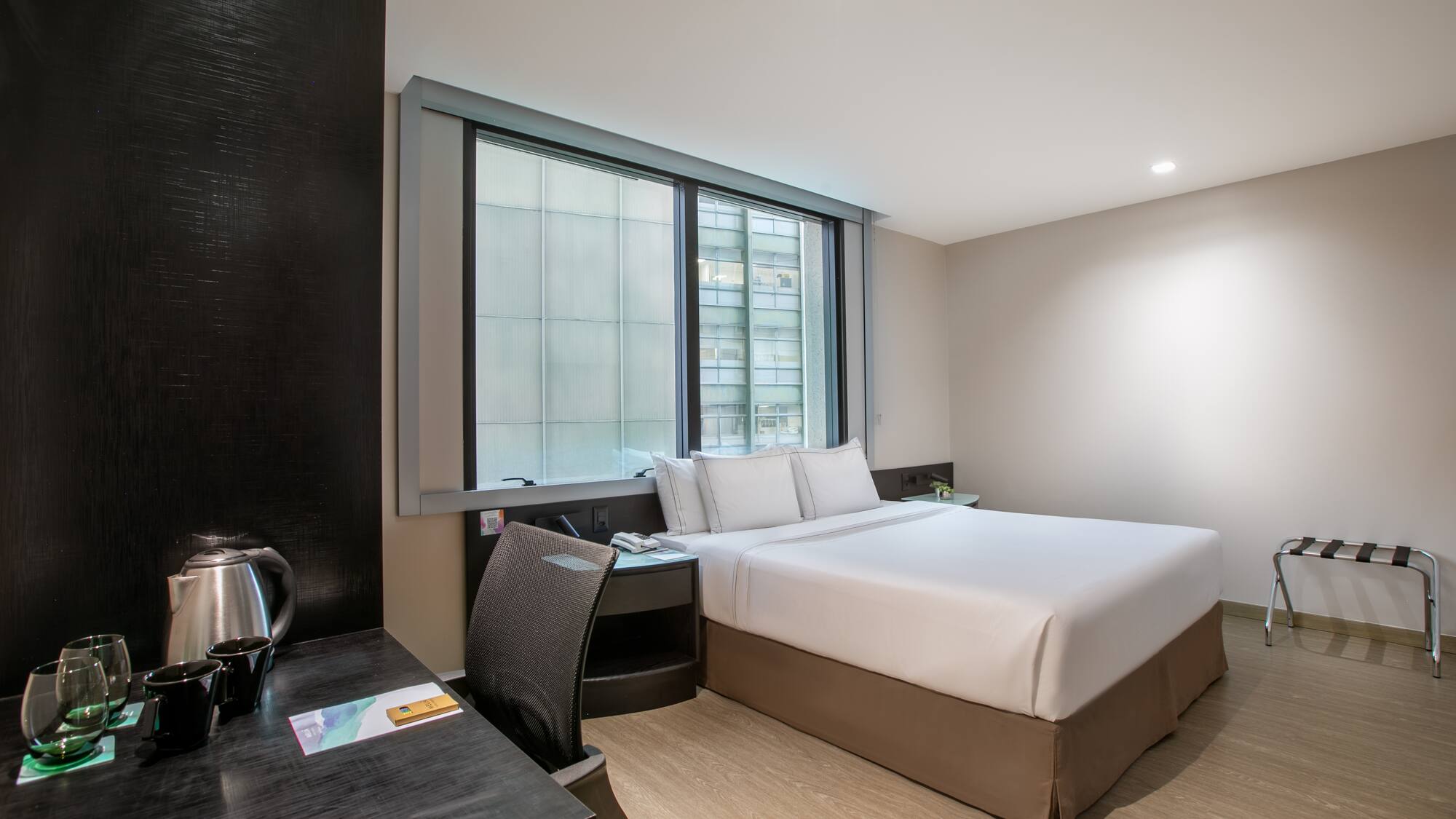 a room with a bed and a desk