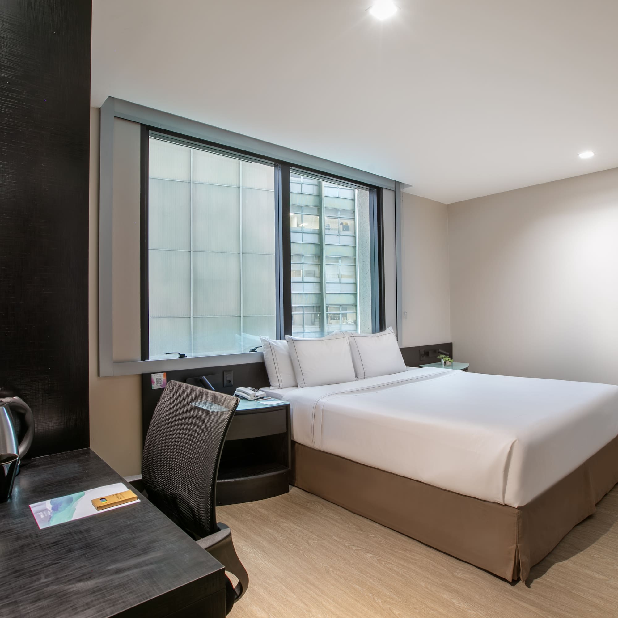 a room with a bed and a desk