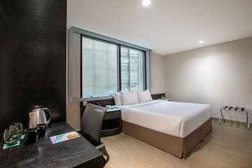 a room with a bed and a desk