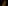 Dark figure with face paint performing sand ritual in dramatic light.