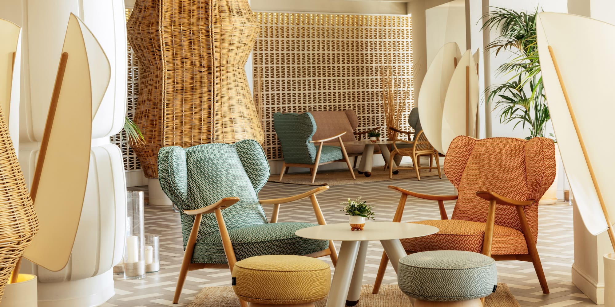 a room with wicker furniture and a table