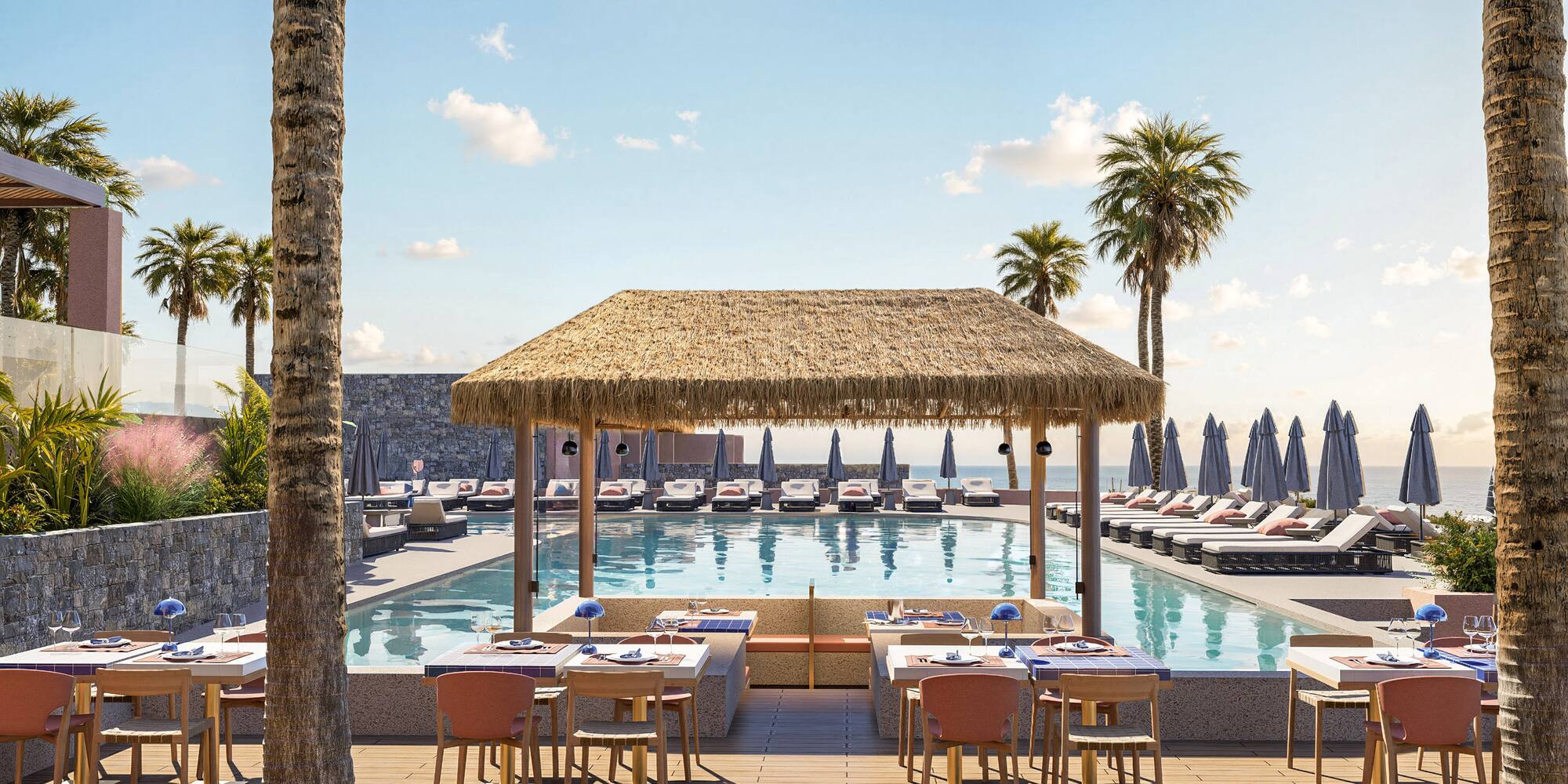 a pool with tables and chairs