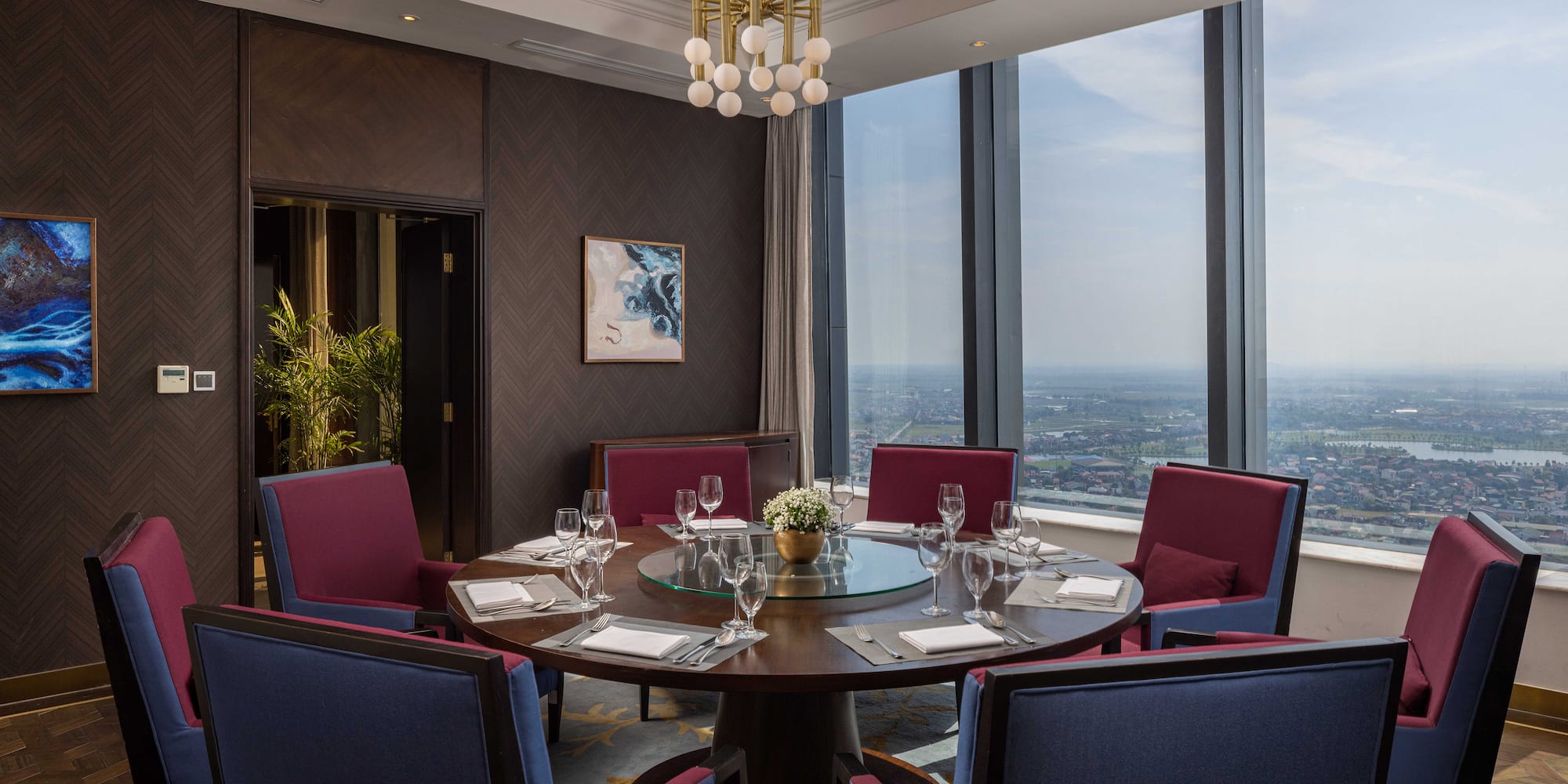 a room with a round table and chairs