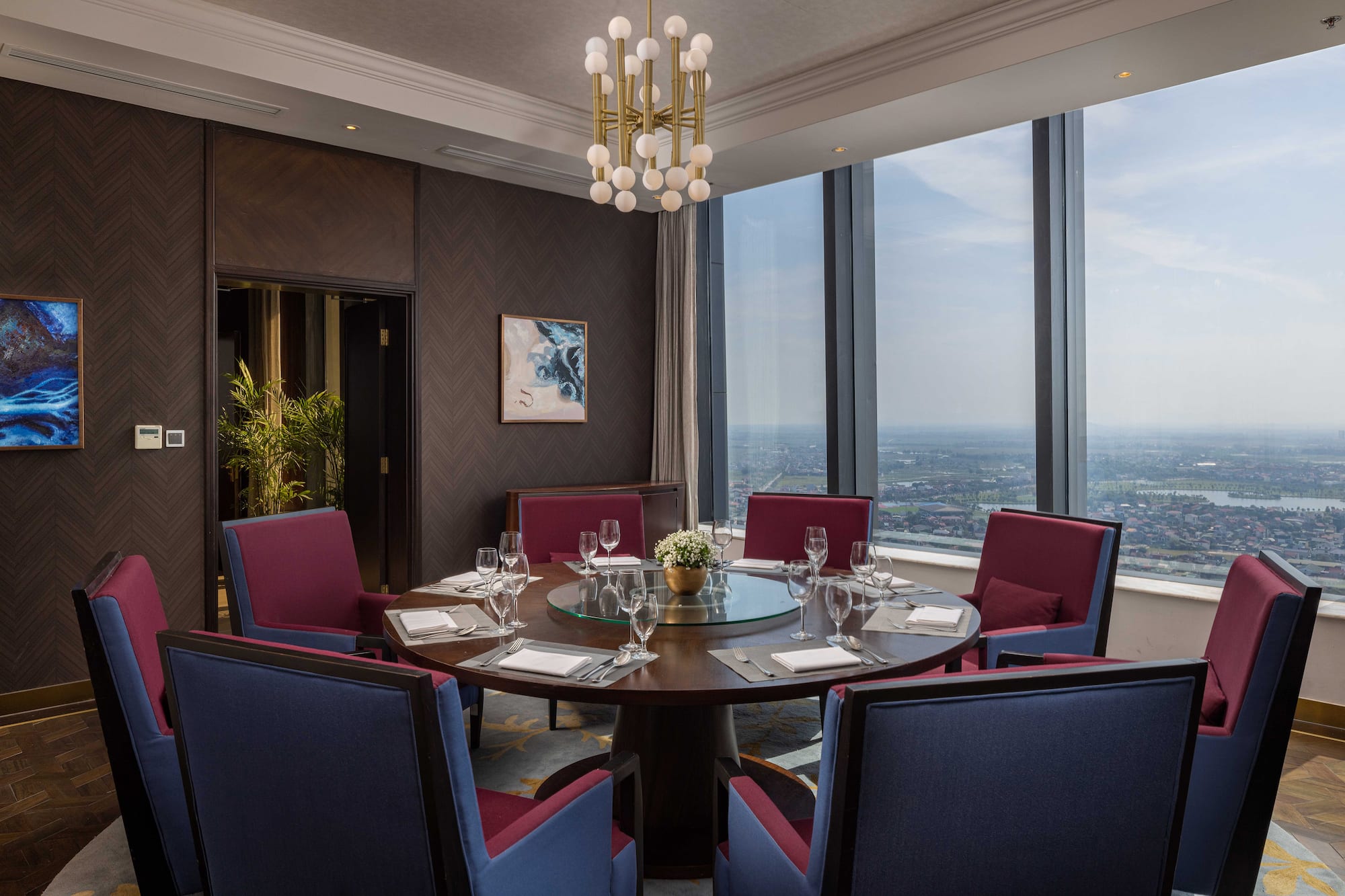 a room with a round table and chairs
