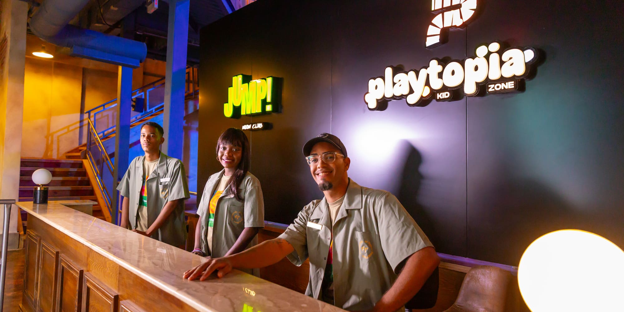 a group of people standing at a counter